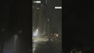 Crane wedged in building by Hurricane Milton