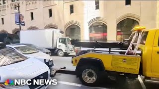 Video shows truck trying to tow car with driver inside