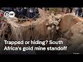 Families urge authorities to rescue illegal gold miners in South Africa | DW News