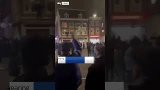 Palestinian flag pulled down in Amsterdam as anti-Arab chants are heard in the street