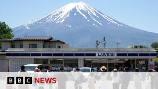 ICONIC Japanese town blocks iconic Mount Fuji view to deter tourists | BBC News