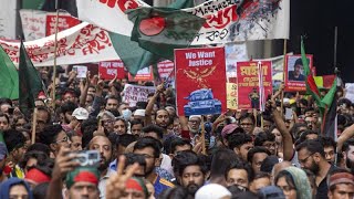 Two dead and dozens injured as thousands protest against prime minister in Bangladesh
