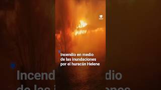 Un incendio consume una casa durante las inundaciones a causa del huracán Helene