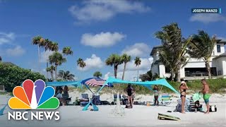 UMBRELLA Florida Residents Push Back On Town&#39;s Beach Umbrella Ban