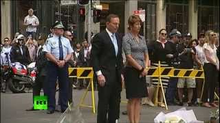 LINDT N Attentats à Sydney: Le premier ministre australien dépose des fleurs devant le café Lindt