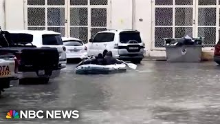 Dubai residents use boat to navigate flooded streets