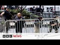 New York police identify man who set himself on fire outside Trump trial court | BBC News