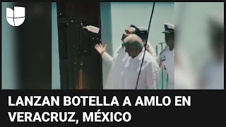 S&U PLC [CBOE] El momento en que lanzan botella a AMLO en su gira de despedida en Veracruz, México