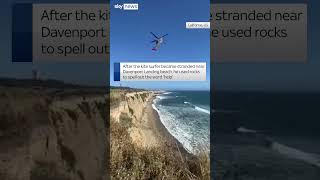 Kite surfer spells &#39;help&#39; to get rescued