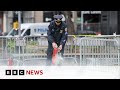 Man sets himself on fire outside Trump trial court in New York | BBC News