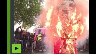 BUCHER N «Au bûcher !» : une tête de Macron, une balle entre les yeux, brûlée à la manifestation du 22 mai