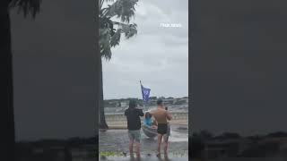 Pro-Trump boaters speed down flooded streets before Hurricane Helene makes landfall