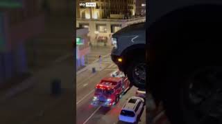 Car hangs from third floor of car park