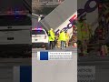 FedEx truck hangs off bridge in New York following crash