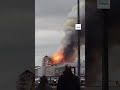 The moment the iconic spire of Copenhagen’s historic stock exchange building collapsed in a  fire.