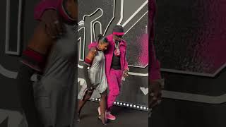 Flavor Flav and Jordan Chiles Together on the VMAs Carpet