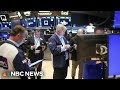 DOW JONES INDUSTRIAL AVERAGE - Dow closes above 40,000 for first time ever