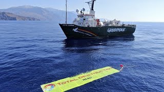 ROYAL DUTCH SHELLA Greenpeace activists board vessel carrying Shell oil platform