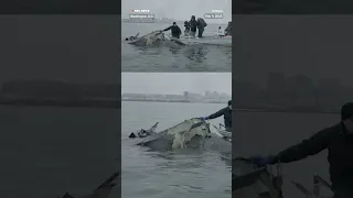 Video shows recovery of Army Blackhawk helicopter wreckage in Potomac River.