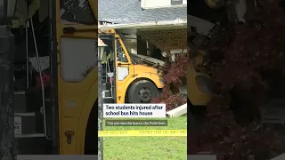 Two students injured after school bus hits house