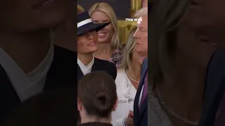 Trump&#39;s cheek kiss is blocked by Melania&#39;s hat