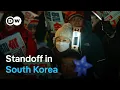 South Koreans turn out for rival demonstrations as president defies arrest | DW News