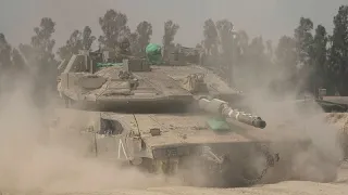 Israel says it will allow &#39;basic&#39; amount of aid into Gaza as it expands ground offensive