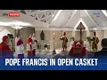 Vatican releases images of Pope in open coffin