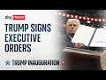 President Donald Trump attends parade and signs executive orders in Washington