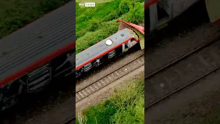 Train hits tractor trailer as arrest made