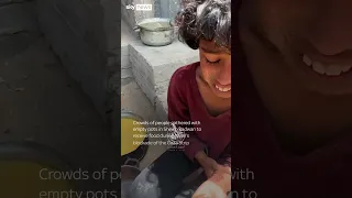 Gazans wait for food at charity kitchen in Gaza City as limited aid allowed in