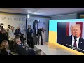 Davos attendees watch Donald Trump's inauguration at Ukraine House watch party