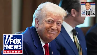 President Trump signs executive orders from the Oval Office