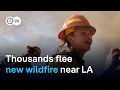 Residents told to leave as new blaze spreads north of Los Angeles, fanned by strong winds  | DW News