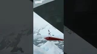 Ballerina dances on top of ship&#39;s bow