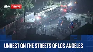 National Guard troops clash with protesters in Los Angeles