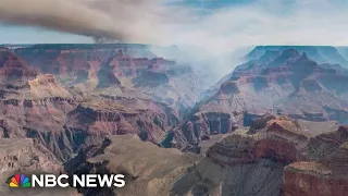 Firefighters battle wildfires raging near Grand Canyon